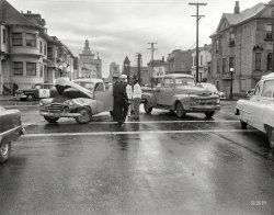 Oakland, California, circa 1956. "Ambulance at collision." The age-old rivalry of Ford vs. Chevy. 4x5 acetate negative from the News Archive. View full size.