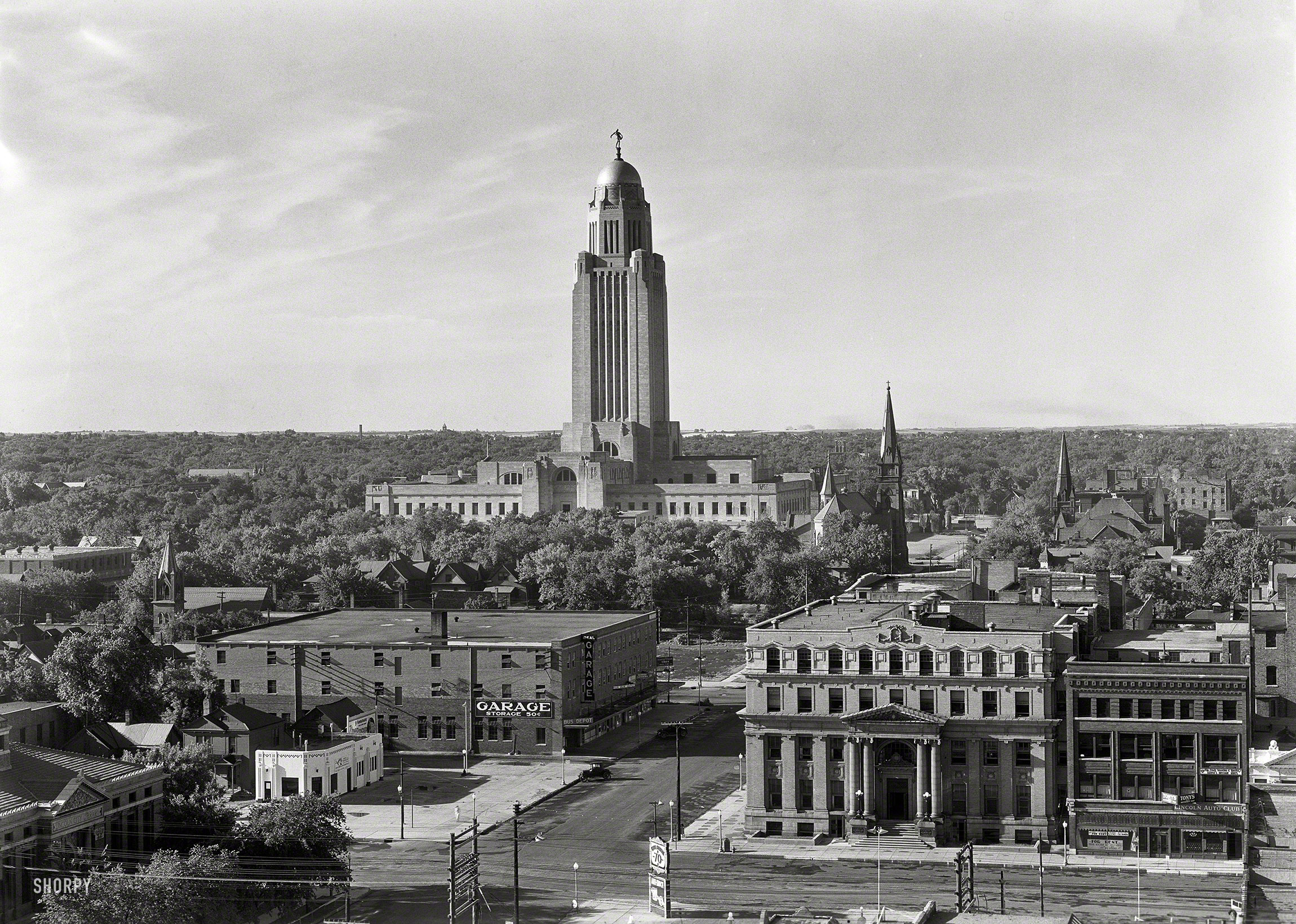 June 21-26, 1934. "Nebraska State Capitol, Lincoln. General view from university, a.m." Large-format acetate negative by Gottscho-Schleisner. View full size.