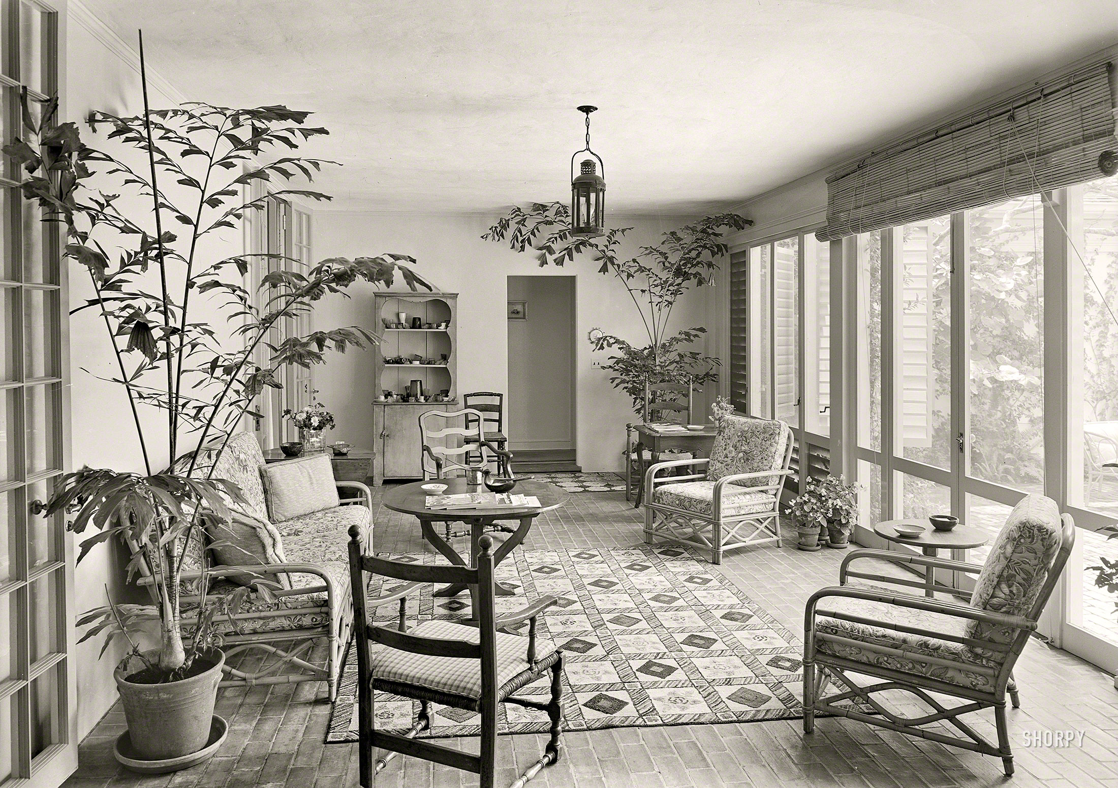 March 29, 1941. "James H. McGraw Jr. residence in Hobe Sound, Florida. Loggia. Henry Corse, architect; Jessup Inc., decorator." Note glass hats and boots among the tchotchkes in the cupboard. Gottscho-Schleisner photo. View full size.