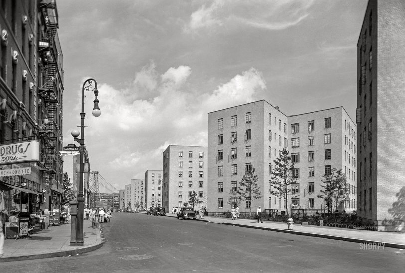 July 14, 1941. "Vladeck Houses, view from Madison and Scammel Streets, New York City. W.F.R. Ballard; Sylvan Bien; Shreve, Lamb &amp; Harmon, architects." Recently completed apartment buildings of the Baruch Charney Vladeck Houses on the Lower East Side, with the Williamsburg Bridge in the distance. Acetate negative by Gottscho-Schleisner. View full size.
