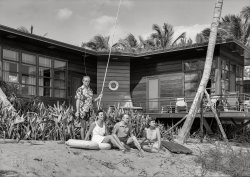 January 14, 1942. "Prince and Princess Alexis Zalstem-Zalessky, residence in Palm Beach, Florida. Miss Knoop, Mr. Wessel, Prince (standing) and Princess on beach. Treanor & Fatio, architect." 5x7 inch acetate negative by Gottscho-Schleisner. View full size.