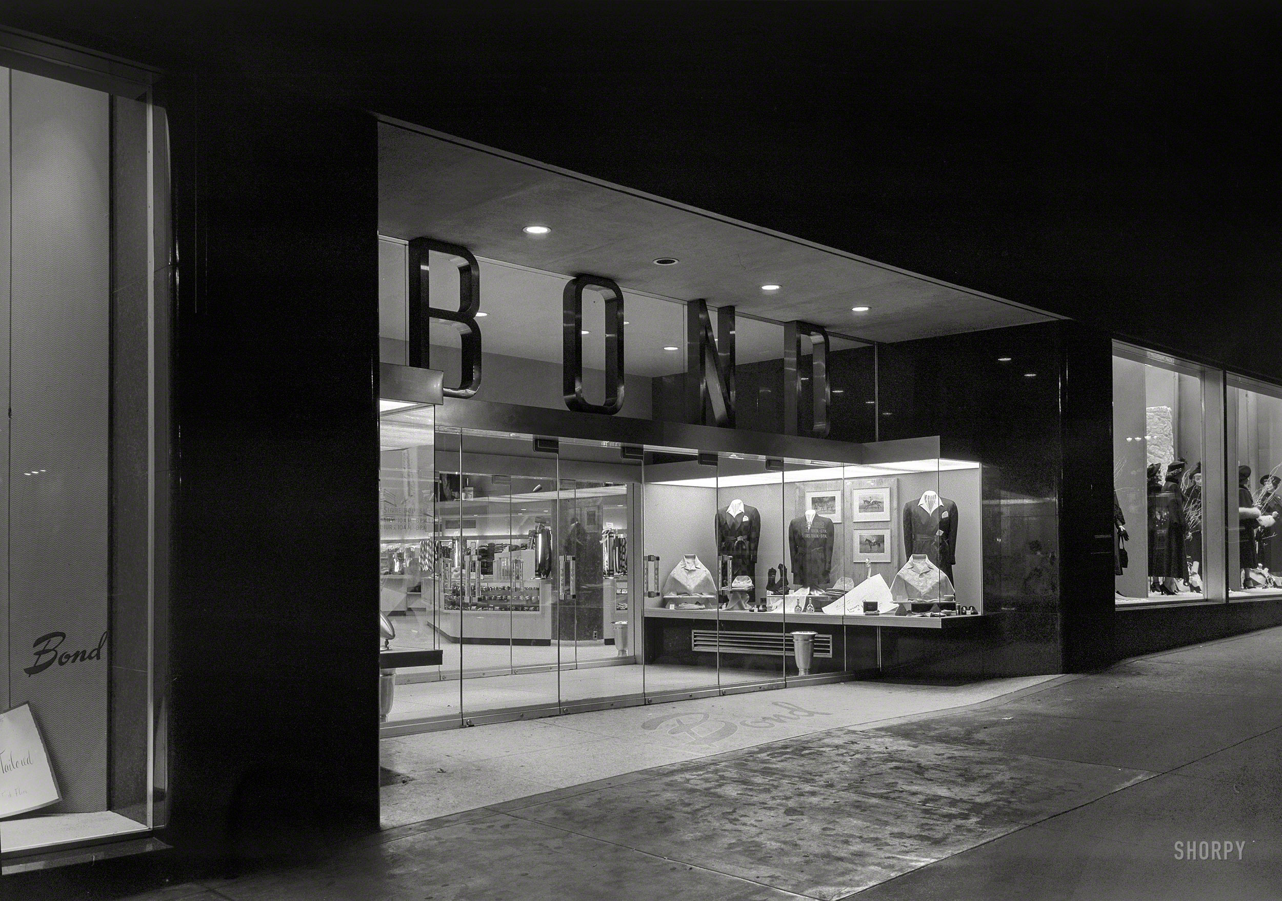 Oct. 31, 1948. "Bond's, New York City. Night exterior, Fifth Avenue." Headless on Halloween! Large-format negative by Gottscho-Schleisner. View full size.