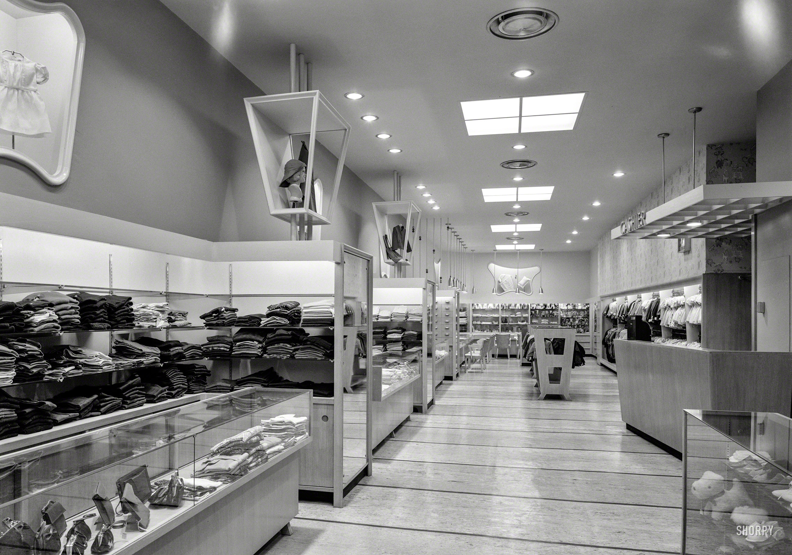 January 27, 1947. "Kartch's, Main Street, Paterson, New Jersey. Interior from entrance." An early glimpse of postwar retailing in all its amoeboid, trapezoidal glory. Large-format acetate negative by Gottscho-Schleisner. View full size.