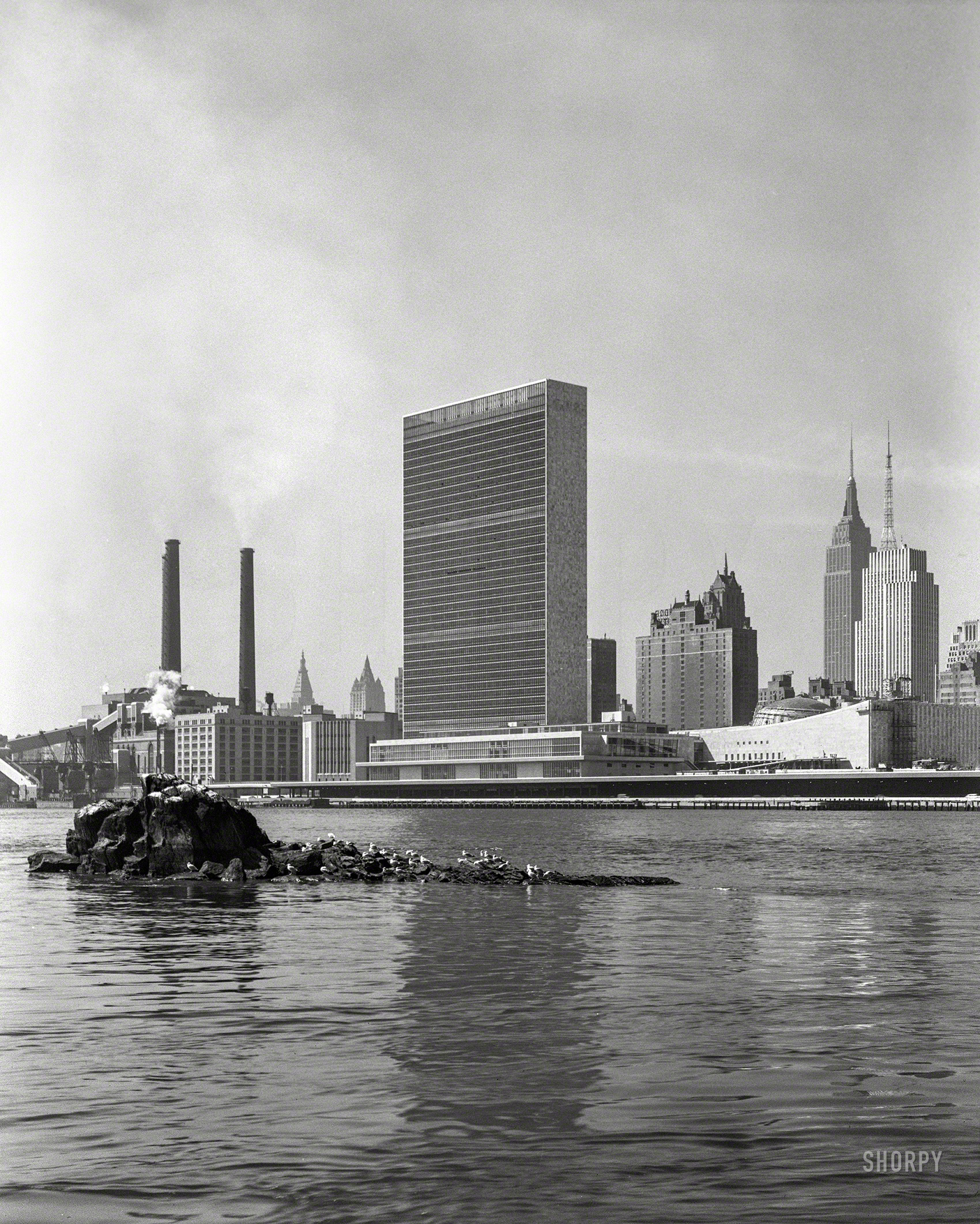March 18, 1952. "United Nations Secretariat and General Assembly from Welfare Island, East River." 5x7 acetate negative by Gottscho-Schleisner. View full size.