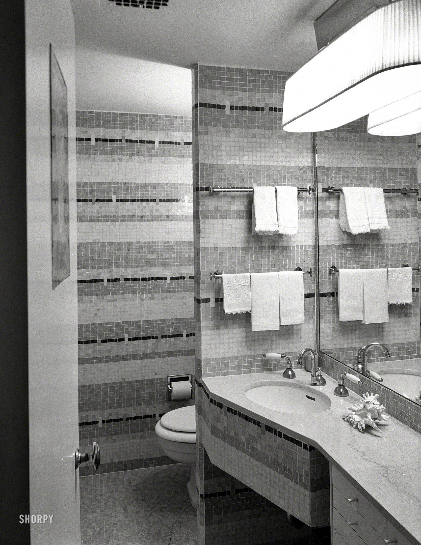 Jan. 25, 1954. "H.F. Fischbach, residence at Hampshire House, Central Park South. Tile bathroom." You'll come for the plumbing but stay for the towels. Large-format acetate negative by Gottscho-Schleisner. View full size.