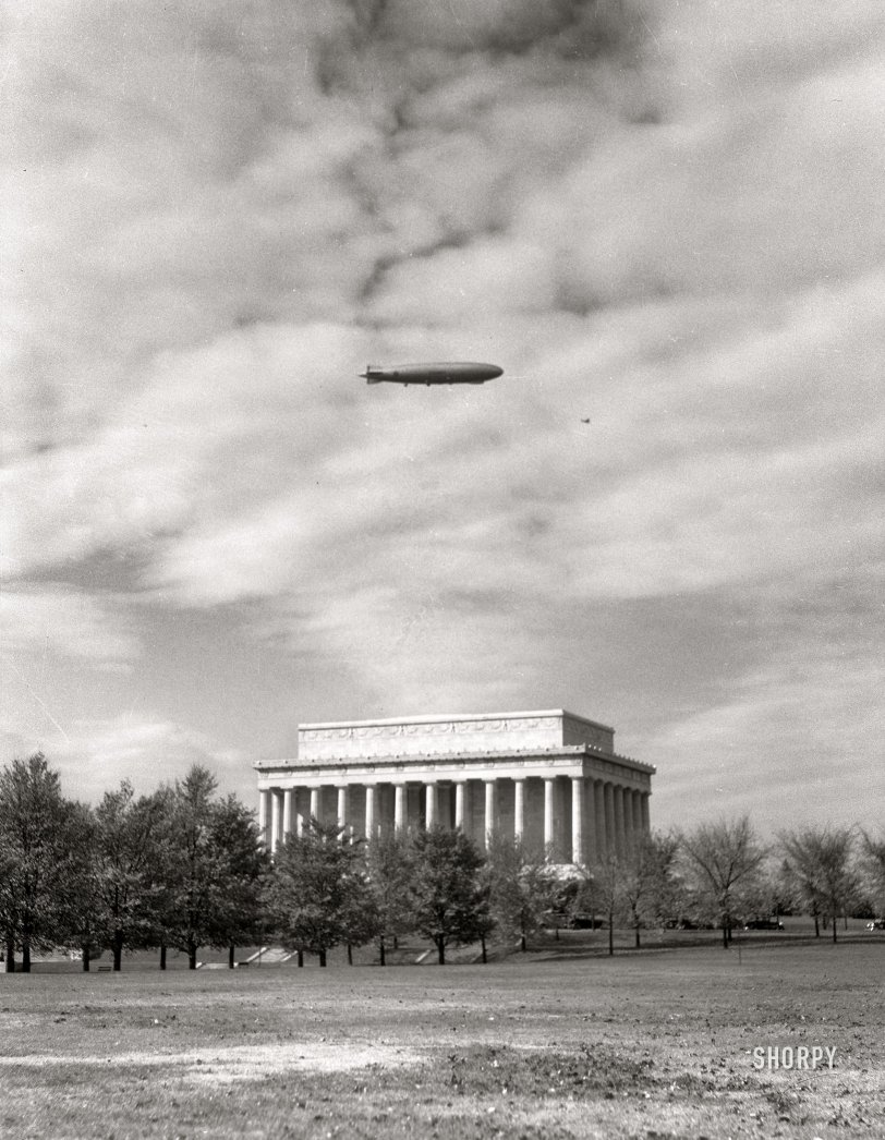 &nbsp; &nbsp; &nbsp; &nbsp; UPDATE: The aviation experts among us aver that the photo shows the USS Los Angeles, not the Akron. In which case the date would be November 2, 1931, when both airships overflew the capital.
August 19, 1932. The Lincoln Memorial in Washington, D.C. "The Navy airship Akron appeared in the morning and after circling the city released several of her small fighting airplanes over Hoover Field. These were later drawn into the hangar constructed on the interior of the airship." 4x5 inch nitrate negative by Theodor Horydczak. View full size.