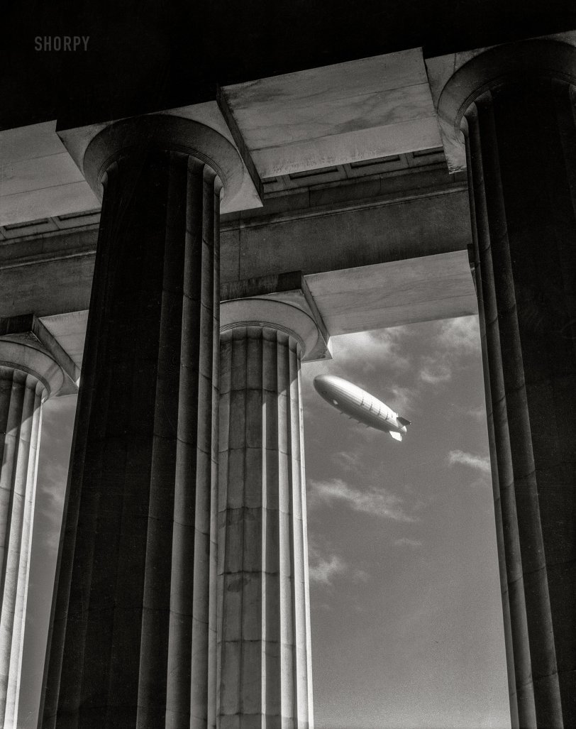 November 2, 1931. Washington, D.C. "Navy airship U.S.S. Akron over the Lincoln Memorial." 4x5 inch nitrate negative by Theodor Horydczak. View full size.


THE AKRON'S VISIT.
&nbsp; &nbsp; &nbsp; &nbsp;  The giant airship Akron arrived yesterday to salute the Capital on its first flight, after having been  officially dedicated to Navy service on Navy Day. Accompanied  by its older, slimmer sister, the Los Angeles, the Akron, bearing 108 men, circled over the city, dipped in salute to the White House, and gave Washingtonians their first chance to see the  world's largest and newest dirigible. (Washington Post, 11.3.31)
