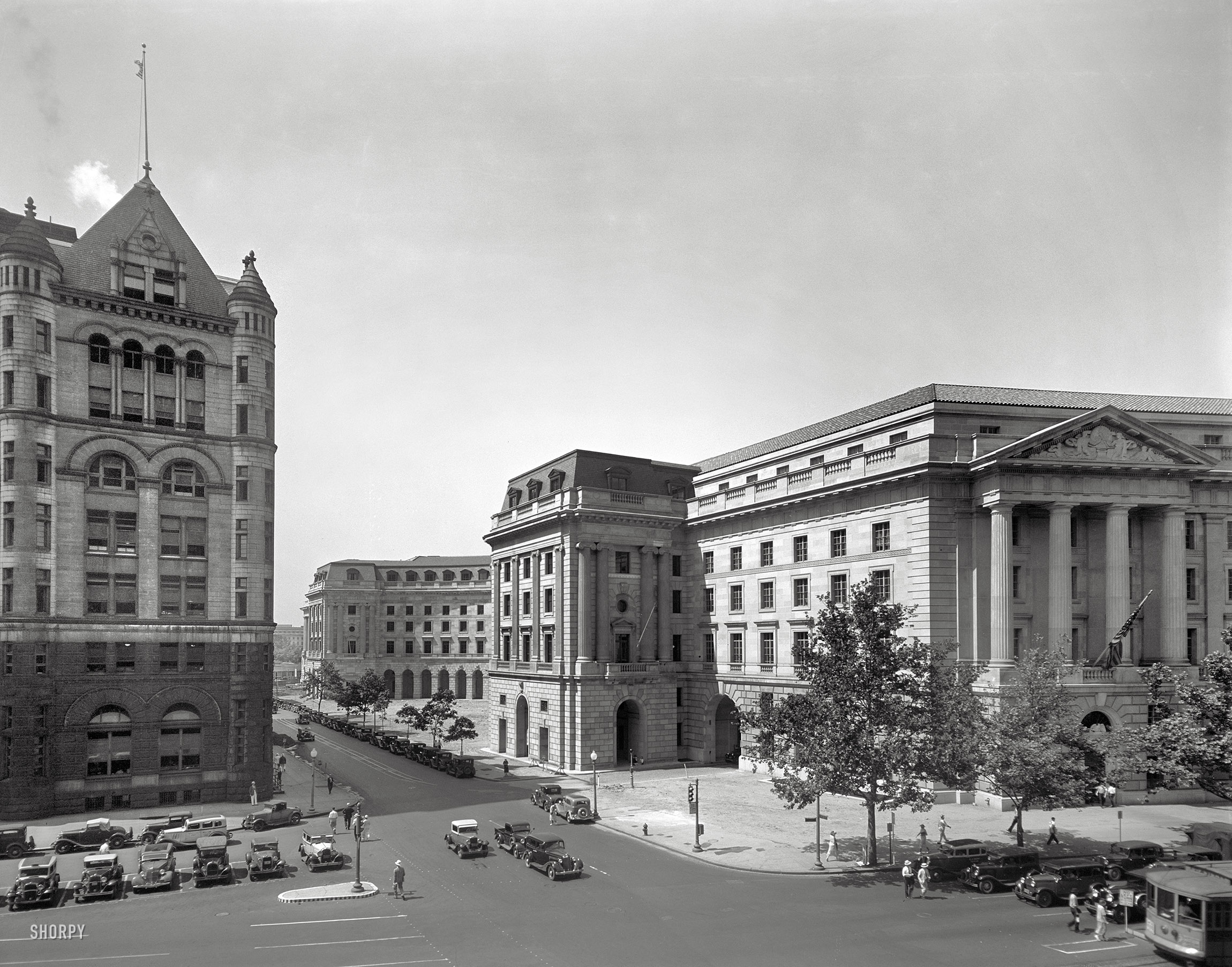 Washington, D.C., circa 1935. "Post Office Department Building (Old Post Office Building or Pavilion). Old (far left) and new Post Office Department." The "new" building, inspired by the Place Vendome in Paris, is now the Ariel Rios Federal Building. 8x10 nitrate negative by Theodor Horydczak. View full size.
