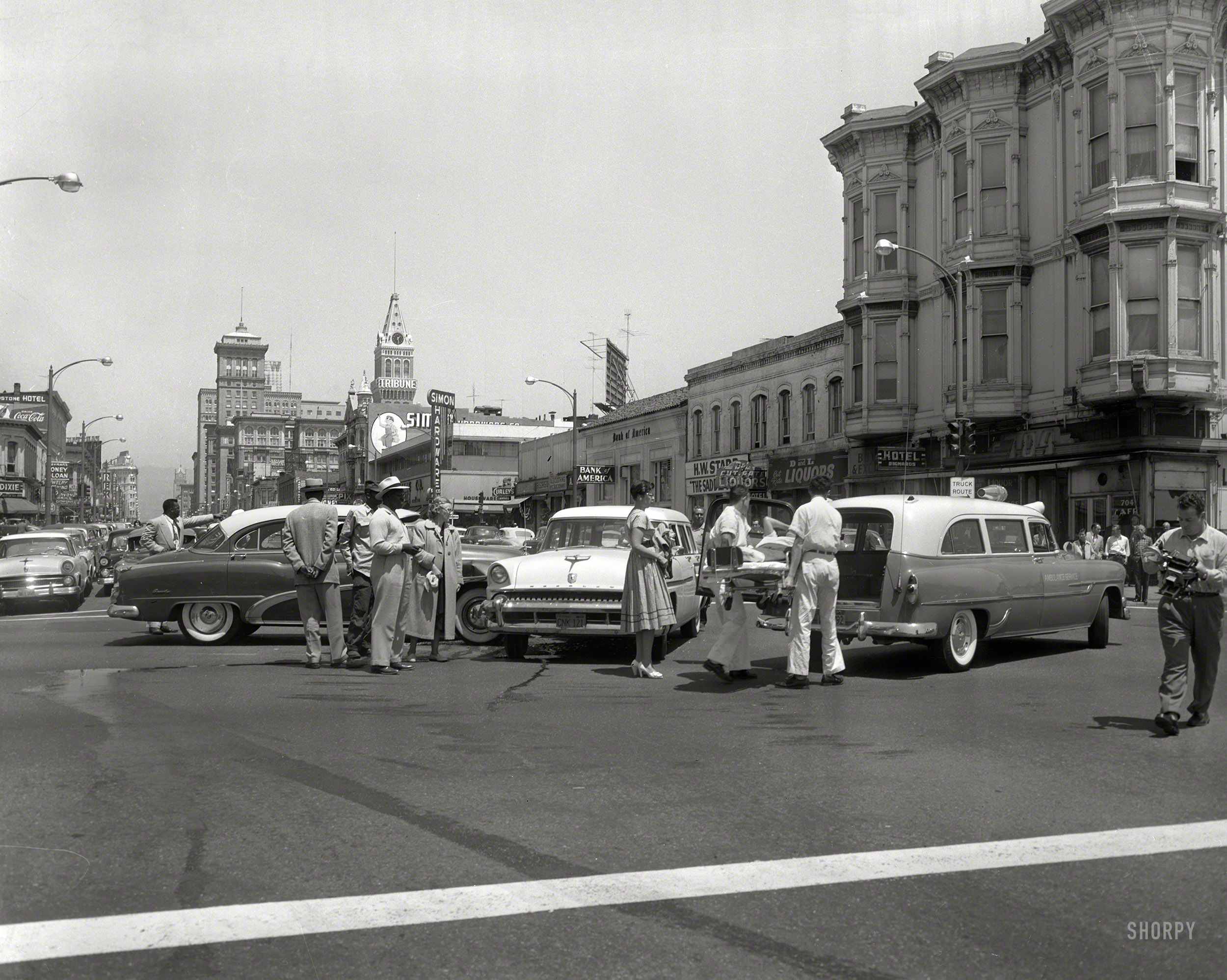 Oakland circa 1957, and another car crash involving an early-1950s Buick. Conven&shy;iently close to the offices of the Oakland Tribune. Not the mention the 704 Cafe and Hotel Richards. 4x5 acetate negative from the News Archive. View full size.
