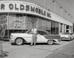 Columbus, Georgia. "Oldsmobile dealer." The Golden Rocket 88 Holiday Sedan for 1957. 4x5 inch acetate negative from the News Archive. View full size.