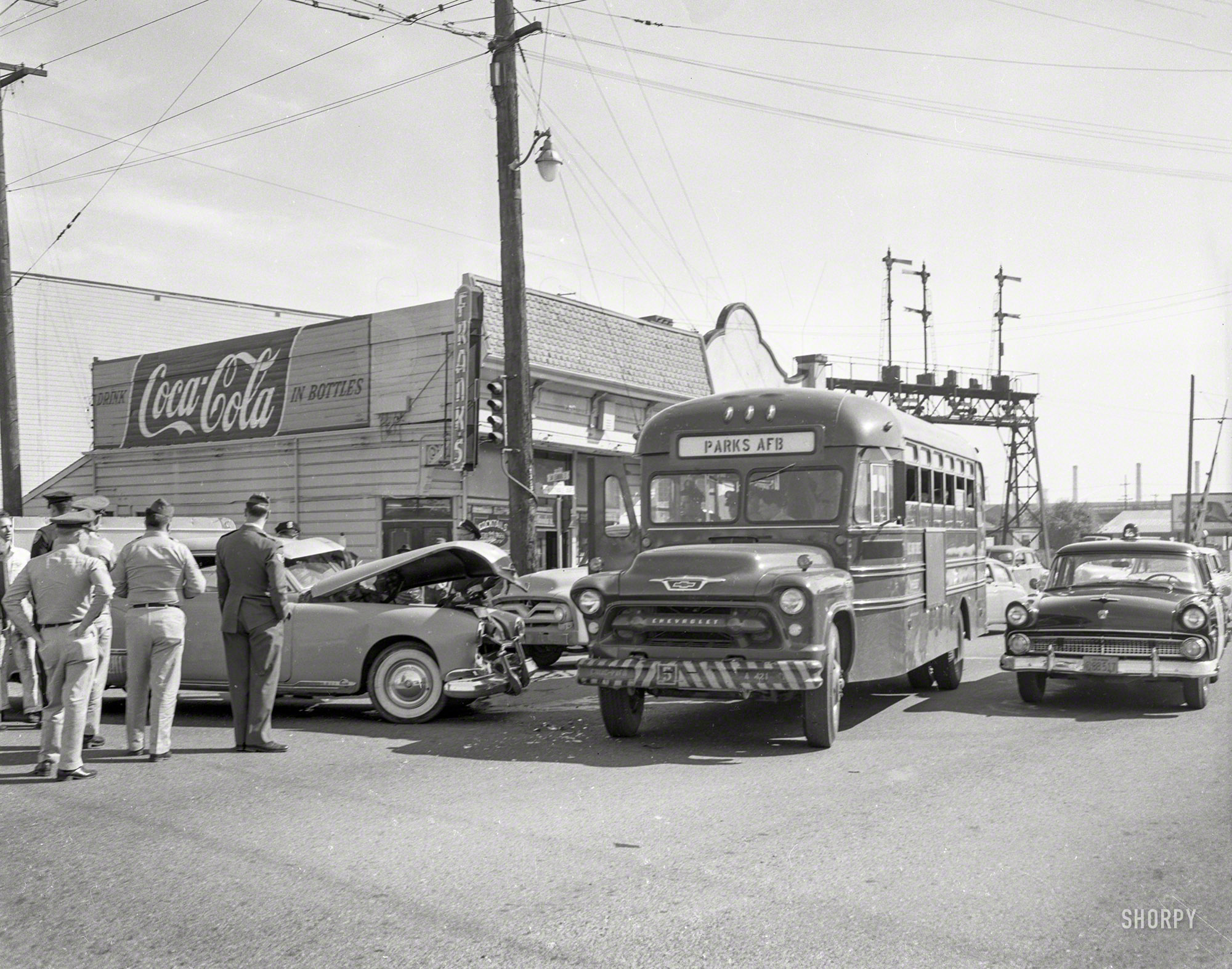 Oakland or vicinity circa 1957. "Collision with bus." Futuramic Oldsmobile meets military shuttle. And as long as we're at Frank's, how about a Coke? In bottles, of course. 4x5 acetate negative from the News Archive. View full size.