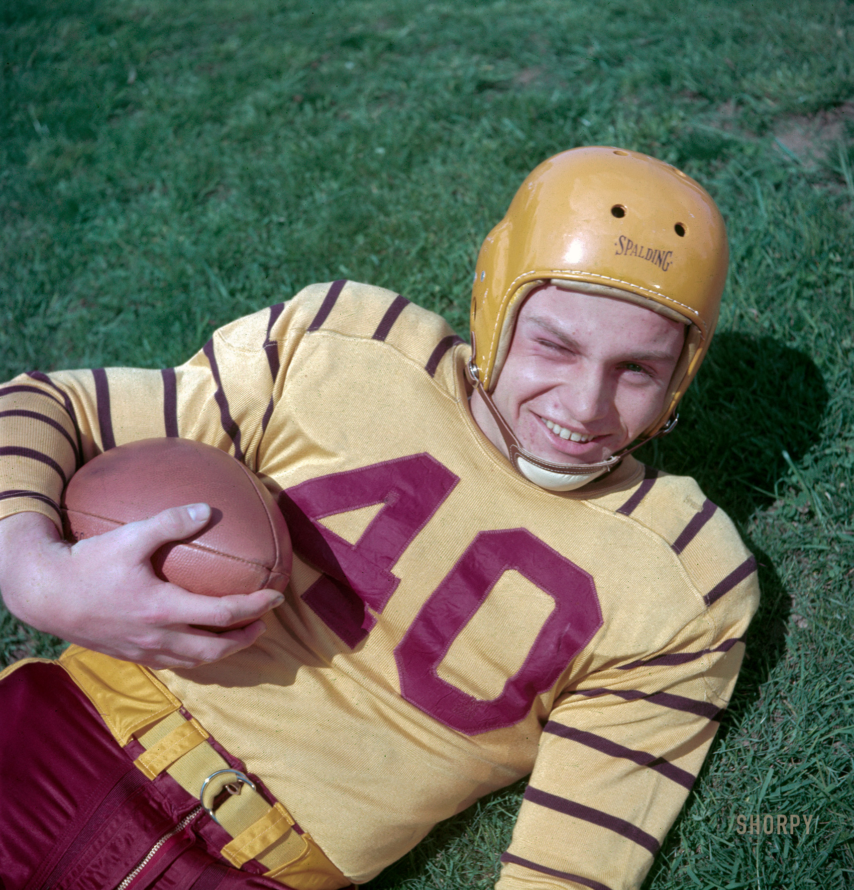 May 1952. "Weymouth (Massachusetts) High School football team. Halfback Glenn Allen of the Weymouth Maroons with football." Color transparency by Jim Hansen for the Look magazine assignment "Championship High-School Football." View full size.