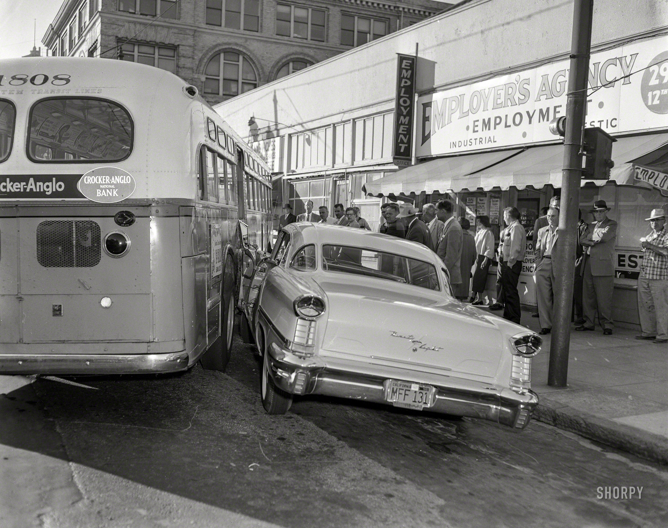 Oakland, Calif., circa 1958. "Transit accident." Latest posting at the employment agency: "Immediate opening, one bus driver." The car: a 1957 Oldsmobile Starfire 98 Holiday Coupe. 4x5 acetate negative from the News Archive. View full size.