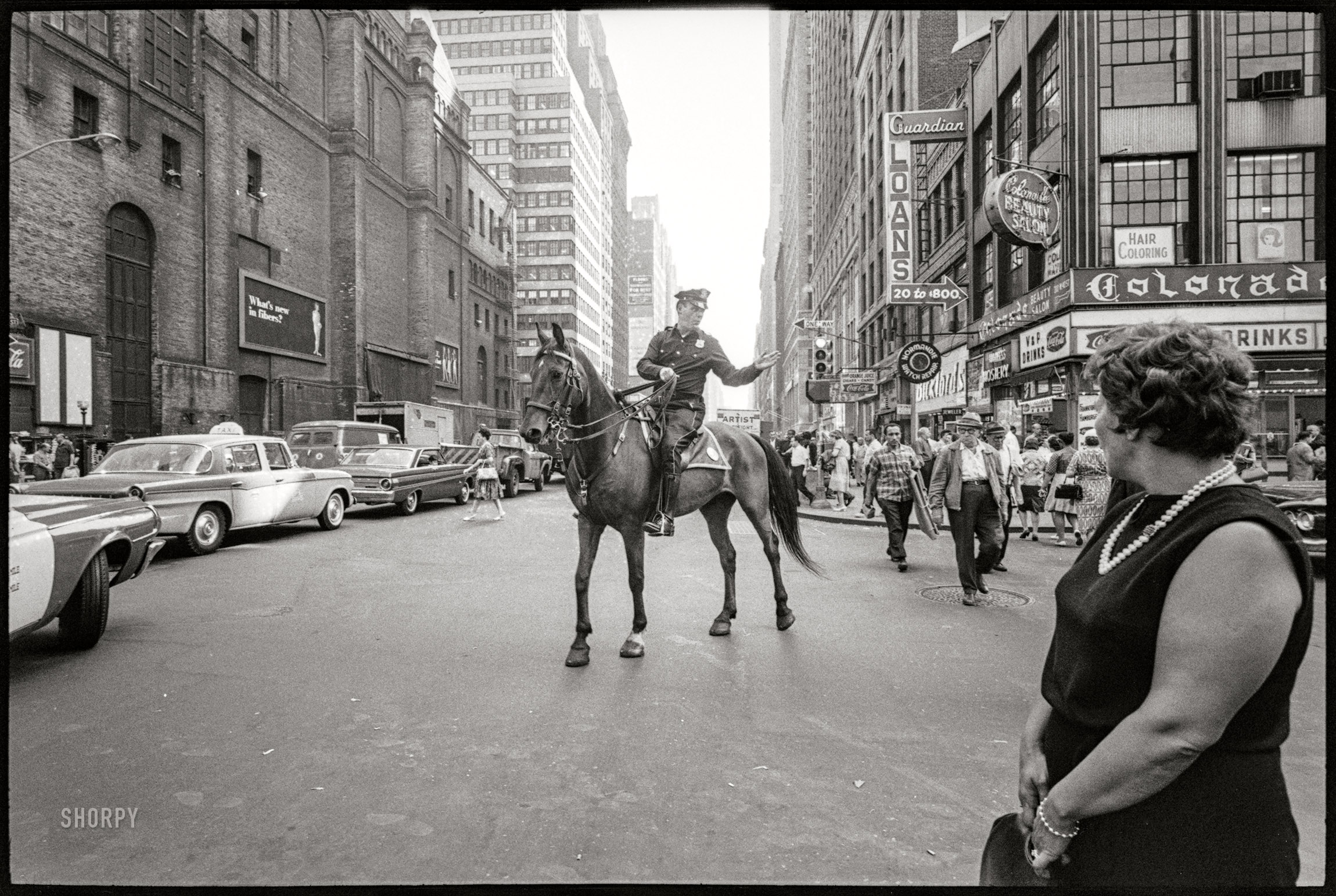 June 1964. New York. "Police officer on horse." Photo by Angelo Rizzuto. View full size.