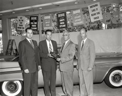 Columbus, Georgia, Dodge dealers in their showroom with one of the last 1958 models, getting ready for the '59s. 4x5 acetate negative. View full size.