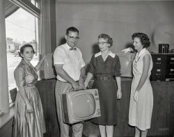 Columbus, Georgia, circa 1960. "Portable TV." RCA Victor "Sportable" TVs, the Research Department informs us. The set so light, you can lift it with three hands! 4x5 acetate negative from the News Archive. View full size.