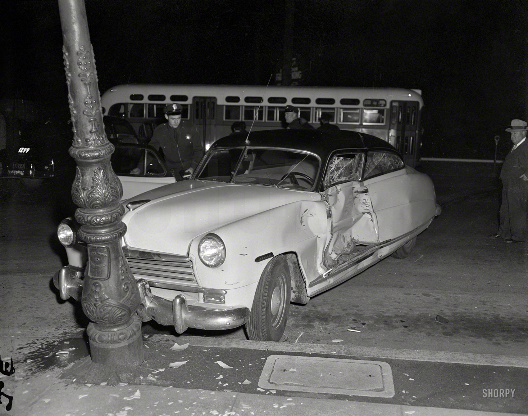 We're back in 1950s Oakland as we return to the scene of yet another accident: Hudson meets lamppost after being hit broadside. The car's unit body seems to have held up fairly well. 4x5 negative from the News Archive. View full size.