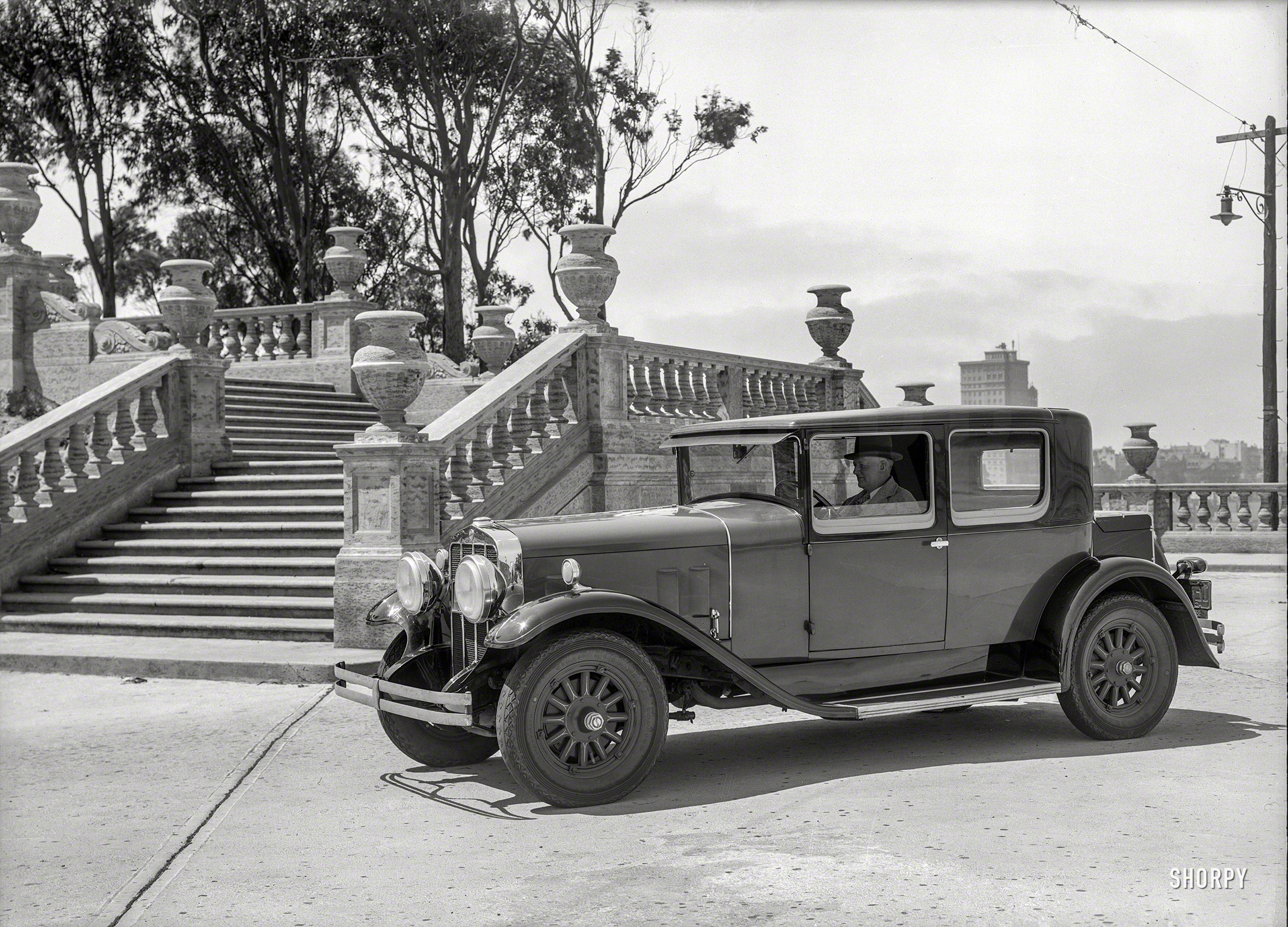 San Francisco, 1929. "Franklin sedan at Pioneer Park, Telegraph Hill." The view-blocking "funeral urn" balustrade, like the Franklin, proved unpopular with motorists and soon vanished. 5x7 glass negative by Chris Helin. View full size.