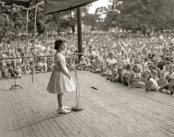 &nbsp; &nbsp; &nbsp; &nbsp; UPDATE: The Annenberg Foundation caption information is off by a year; this is 13-year-old Brenda Lee at Centennial Park on June 8, 1958, performing in a concert sponsored by the Nashville Tennessean. (Her first Nashville performance was at night – a double bill with Pat Boone at Ryman Auditorium on September 16, 1957.)
Brenda Lee, "Little Miss Dynamite," in 1957 at age 12, in her first Nashville performance. Photo by Elmer Williams / Annenberg Space for Photography. View full size.