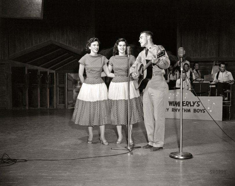 Springfield, Missouri, circa 1959. "Sibling vocal trio The Browns -- Maxine, Bonnie, and Jim Ed -- with Bill Wimberly's Country Rhythm Boys on Jubilee USA, broadcast nationally on ABC-TV." In 1959 their single "The Three Bells" hit No. 1 on the Billboard Hot 100 pop and country charts. Photo by Elmer Williams / Annenberg Space for Photography. View full size.