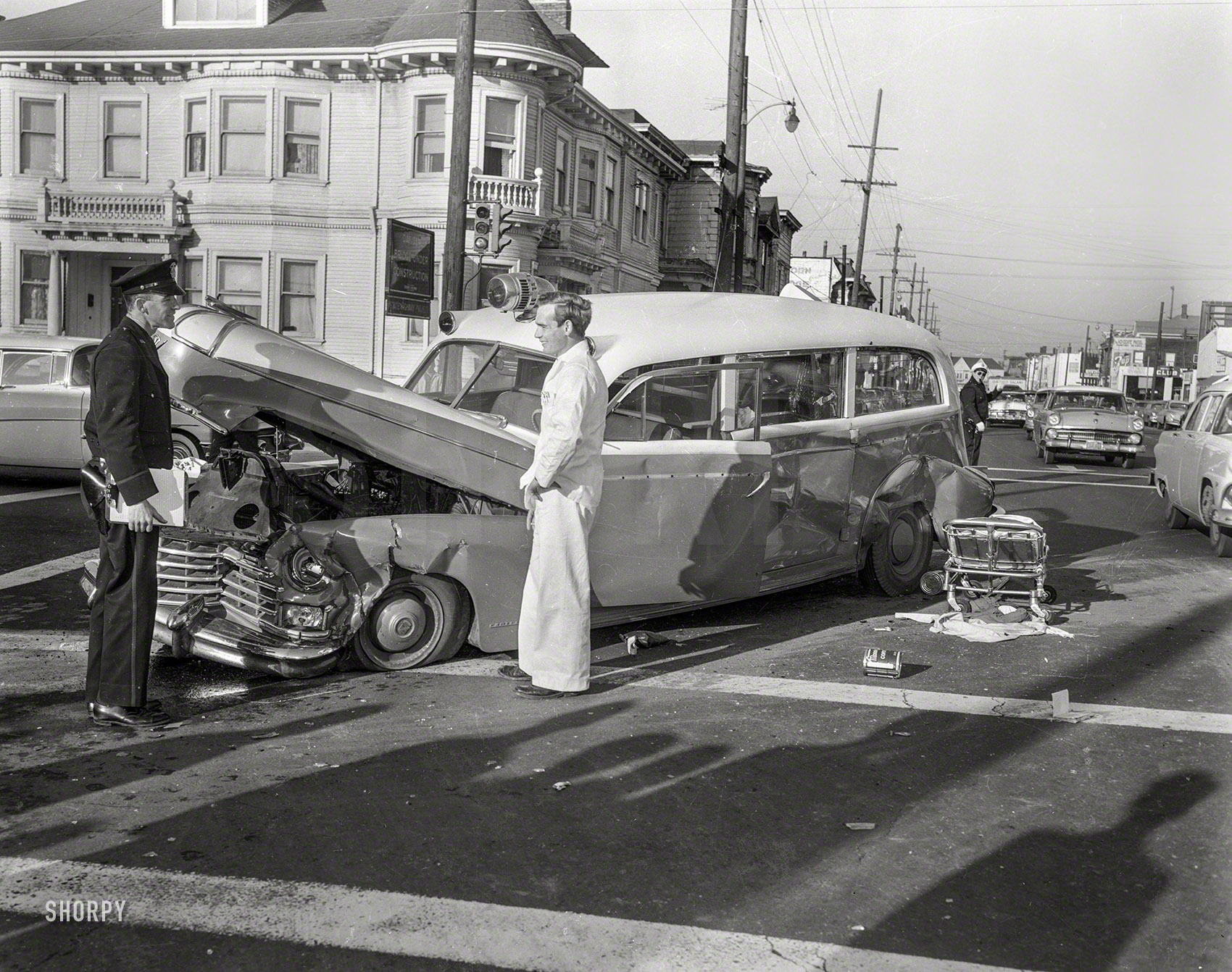 Oakland, California, circa 1957. "Ambulance accident." Don't even ask what happened to the tow truck. 4x5 negative from the News Archive. View full size.