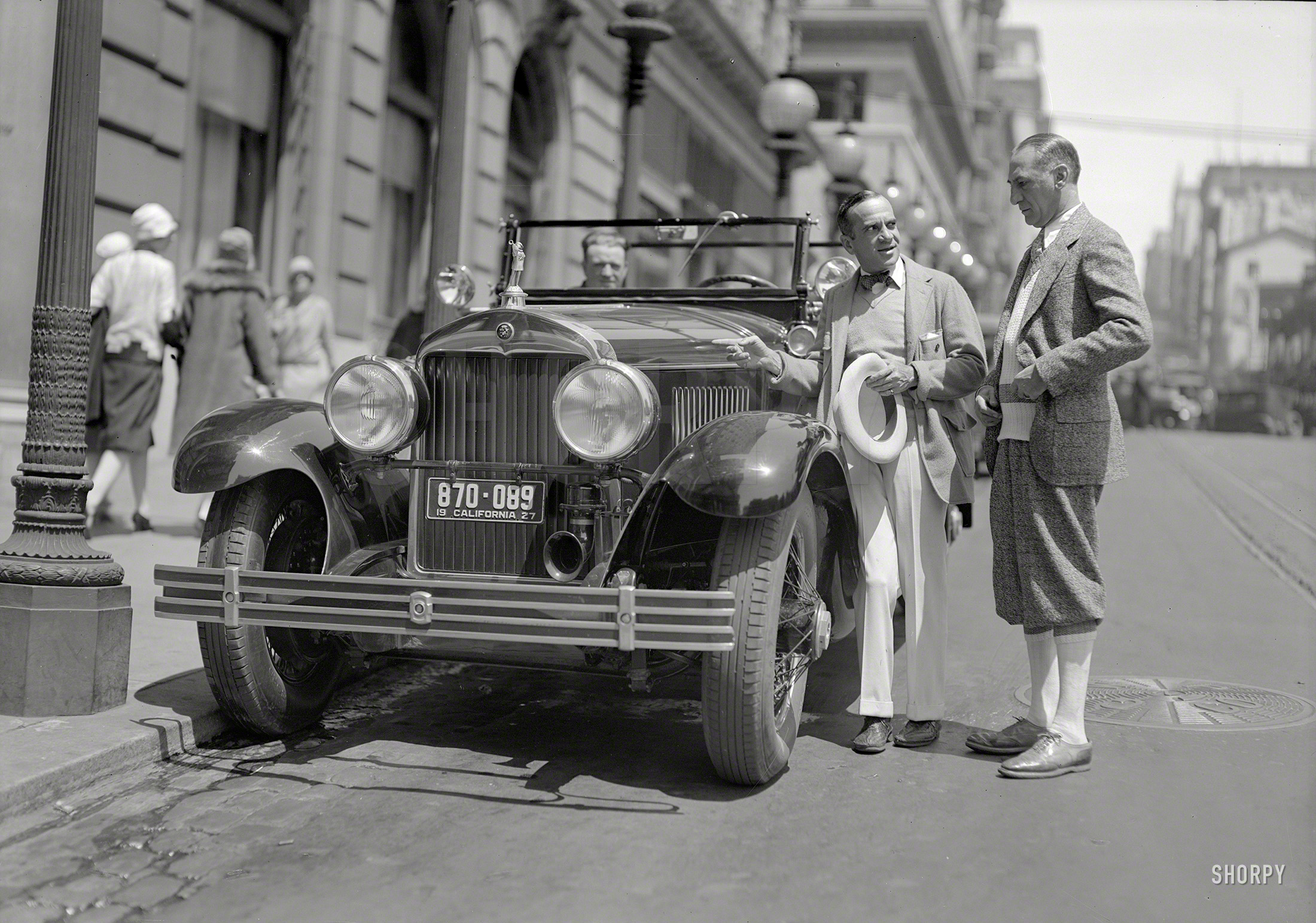 "Al Jolson and Cadillac touring car at St. Francis Hotel, San Francisco, 1927." The year he made talkie history in "The Jazz Singer." 5x7 glassneg. View full size.