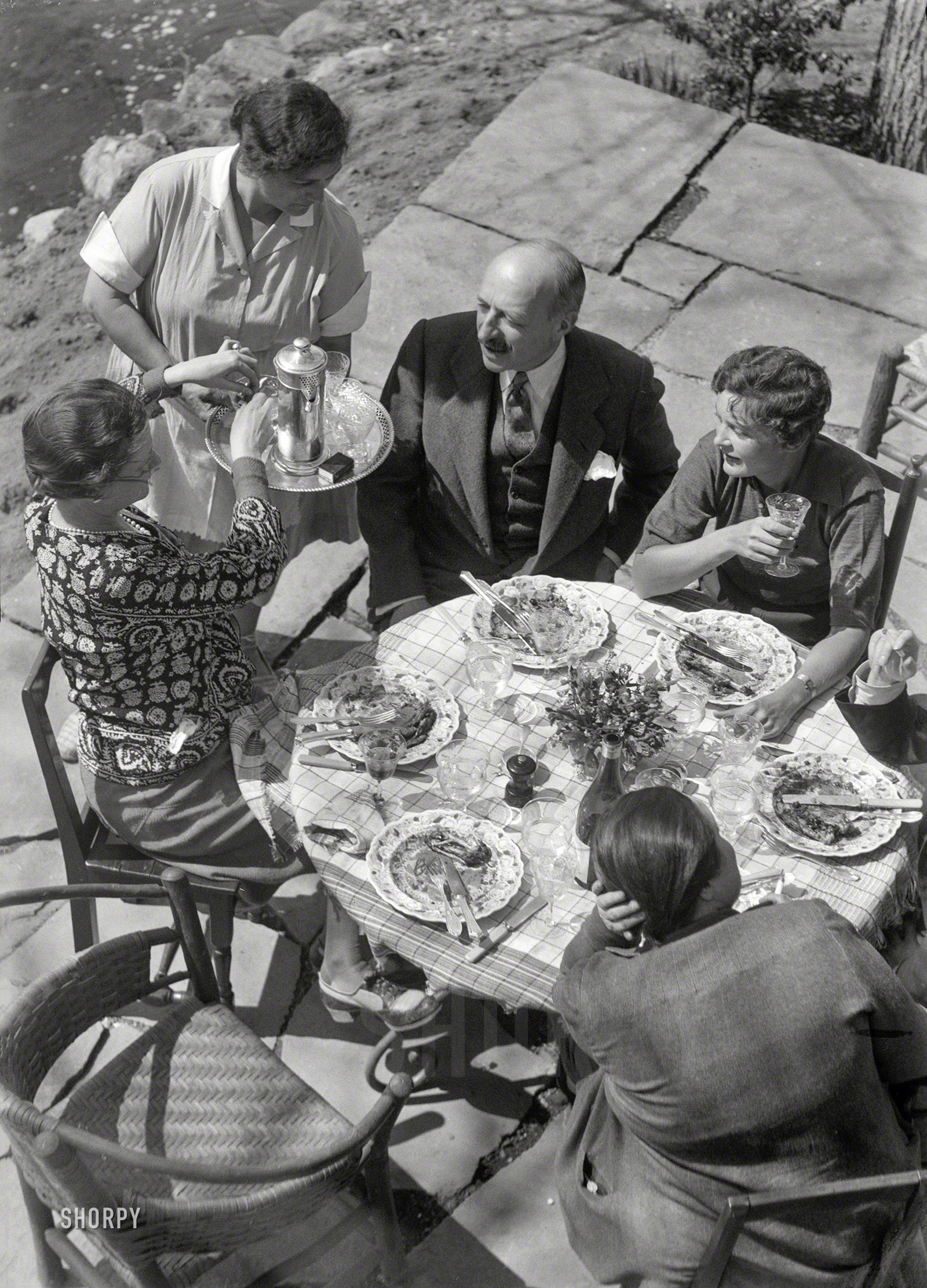 1933. "Mrs. Mary Benson and guests." Depression? What Depression? 4x5 nitrate negative by New York society photographer Arnold Genthe. View full size.