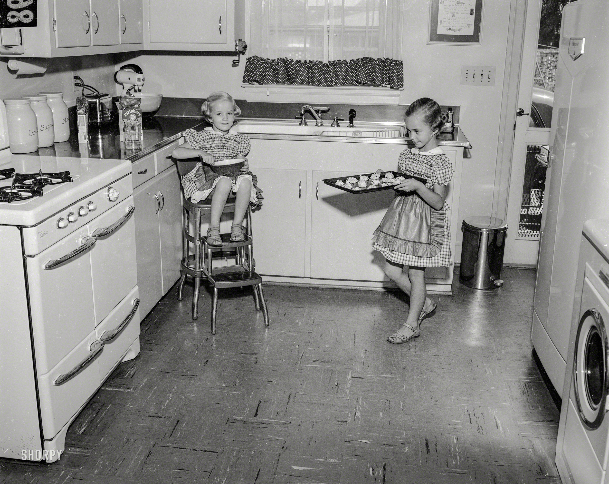 Columbus, Georgia, circa 1955, and our second visit with the Fabulous Baker Sisters. For Boomers of a certain age, this kitchen will likely spark a bonfire of memories. 4x5 acetate negative from the News Photo Archive. View full size.