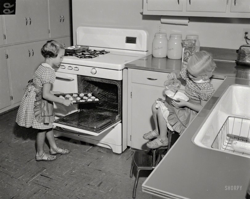 Columbus, Georgia, circa 1955. "Girls baking." Shorpy volunteers to taste the first batch. 4x5 acetate negative from the News Photo Archive. View full size.
