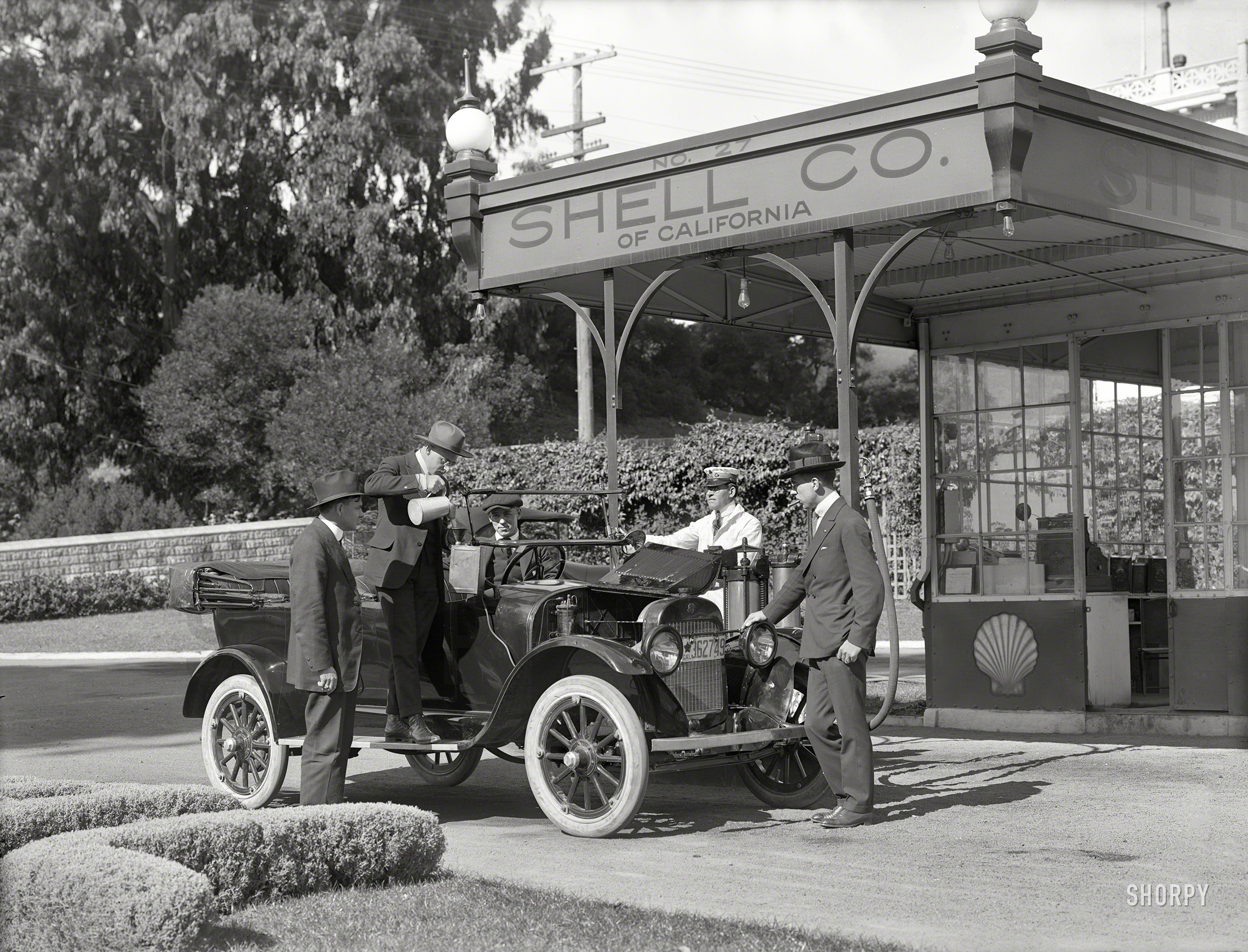 San Francisco, 1919. "Shell Oil Co. service station No. 27." Filling something with something, and smoke 'em if you got 'em. 5x7 inch glass negative, formerly of the Wyland Stanley and Marilyn Blaisdell collections. View full size.