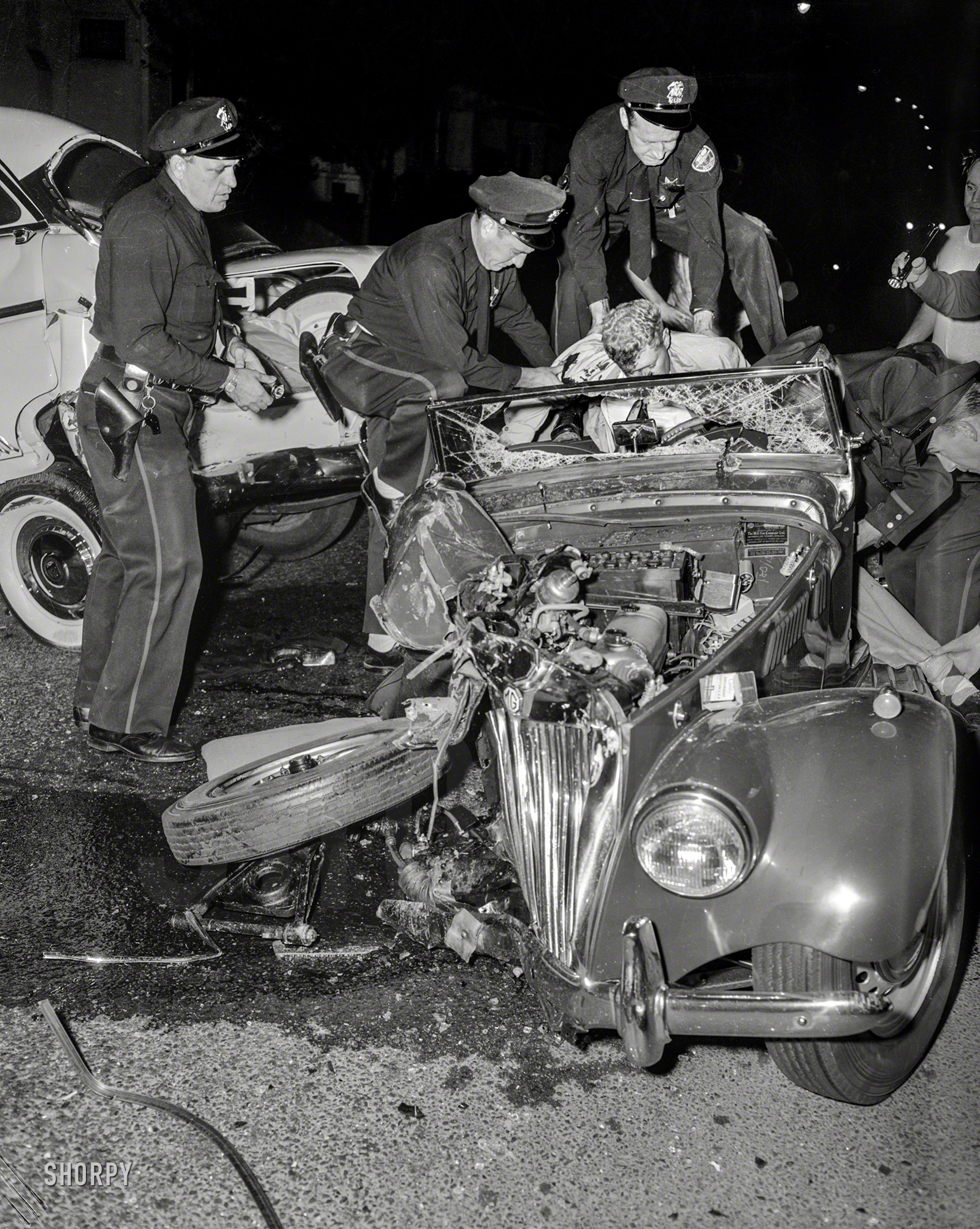 Oakland, Calif., circa 1956. "Traffic Division first aid." This holiday weekend, let's be careful out there! 4x5 negative from the News Photo Archive. View full size.