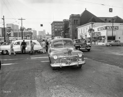 Oakland circa 1953 and another vehicular misadventure, this time starring the bike that couldn't quite dodge a Dodge. Cameos by two Cadillacs. View full size.