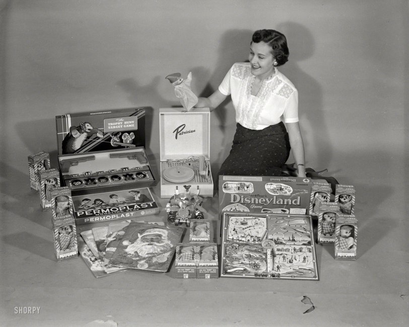 Columbus, Ga., circa 1955. "Toys for Christmas." Starring Zany Puppets, a Transogram "Disneyland" board game, Patrician phonograph, Permoplast  clay and "Trophy Hunt" target game. 4x5 negative from the News Archive. View full size.
