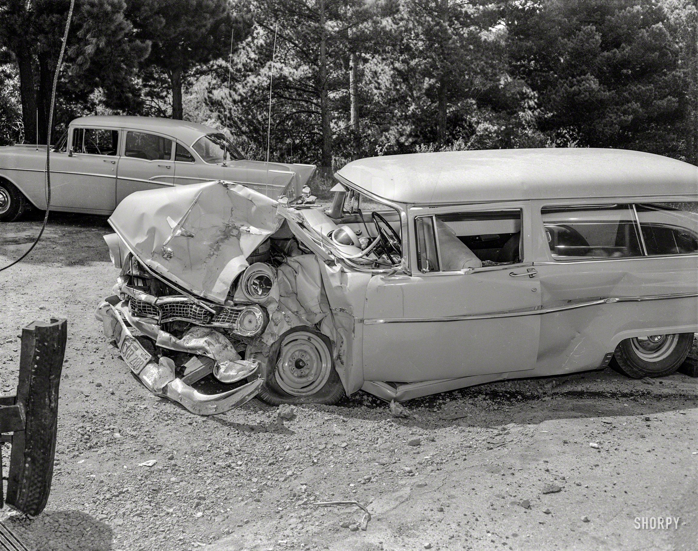 We return to accident-prone Oakland, circa 1958, for this view of a Ford Ranch Wagon that just bought the farm. 4x5 acetate negative. View full size.