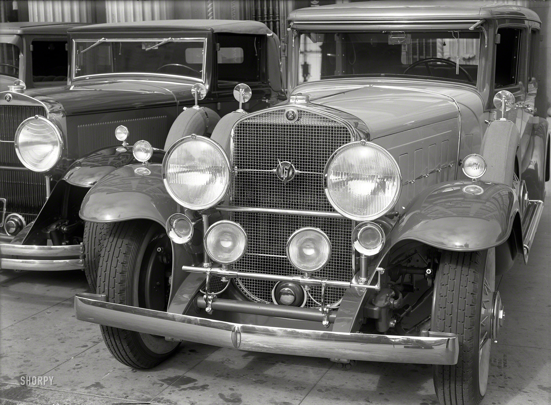 San Francisco circa 1931. "V-16 at Don Lee Cadillac agency." A sixteen-cylinder leviathan beached on the shoals of the Great Depression. One of these cars might cost as much as 10 Chevrolets. 5x7 glass negative by Chris Helin. View full size.