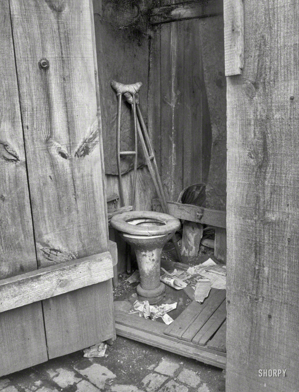 July 1935. "Negro slum privy, Washington, D.C. Within a few hundred yards of the new House Office Building is a row of these unkempt privies." 35mm nitrate negative by Carl Mydans for the Resettlement Administration. View full size.