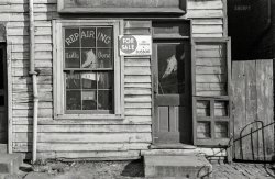 January 1938. Washington, D.C. "Shoe shop on L Street." Right next door to the Good Food Cafe. 35mm nitrate negative by Russell Lee. View full size.
Chewy But DurableAny resemblance between the half-soles installed here and the breaded veal cutlet served next door is strictly fortuitous.
Repairing Neatly Done. While U  eat at the Good Food Cafe?  (I guess a couple of the original painted panes are missing.) 
You can trust their work, the title is correctThe window was neatly repaired without wait.
Addictive OdorsThe small town in which I grew up had a similar shoe repair shop except the adjoining store was a dry cleaner.   The shoe repair establishment had a unique smell of the combination of tanning chemicals, new leather, shoe adhesive, rubber heels (Cat's Paw) and shoe polish and dye.  It was run by a Russian immigrant man and his son and they could fix anything and even built footwear from nothing.  I used to love the smell of the place and had no idea how very dangerous all these chemicals and fumes were but they both did die very young.  The dry cleaners also had its own unique fragrance blend, carbon tet and other unknown fumes but I found their odors much less appealing.  I am not a bloodhound but I am very sensitive  to smells and my memories of everything usually have a distinct   aroma associated with them.  My great aunt's house was cabbage and mothballs. 
(The Gallery, D.C., Russell Lee, Stores & Markets)
