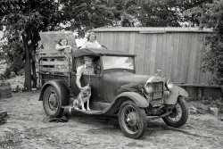 July 1939 near Muskogee, Oklahoma. "Migrant family ready to depart for the journey to California." Elmer Thomas at the wheel. 35mm nitrate negative by Russell Lee for the Farm Security Administration. View full size.