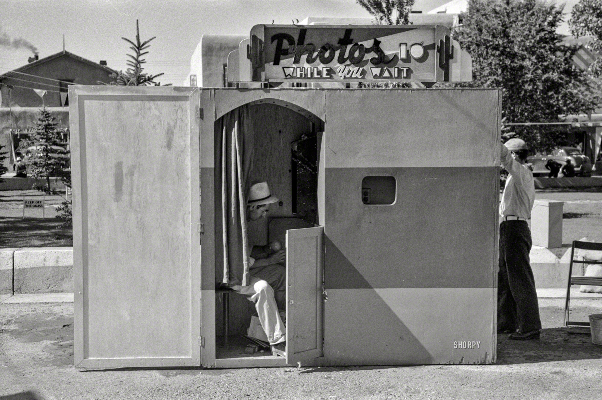 July 1940. "Quick photos at the fiesta at Taos, New Mexico." 35mm negative by Russell Lee for the Farm Security Administration. View full size.