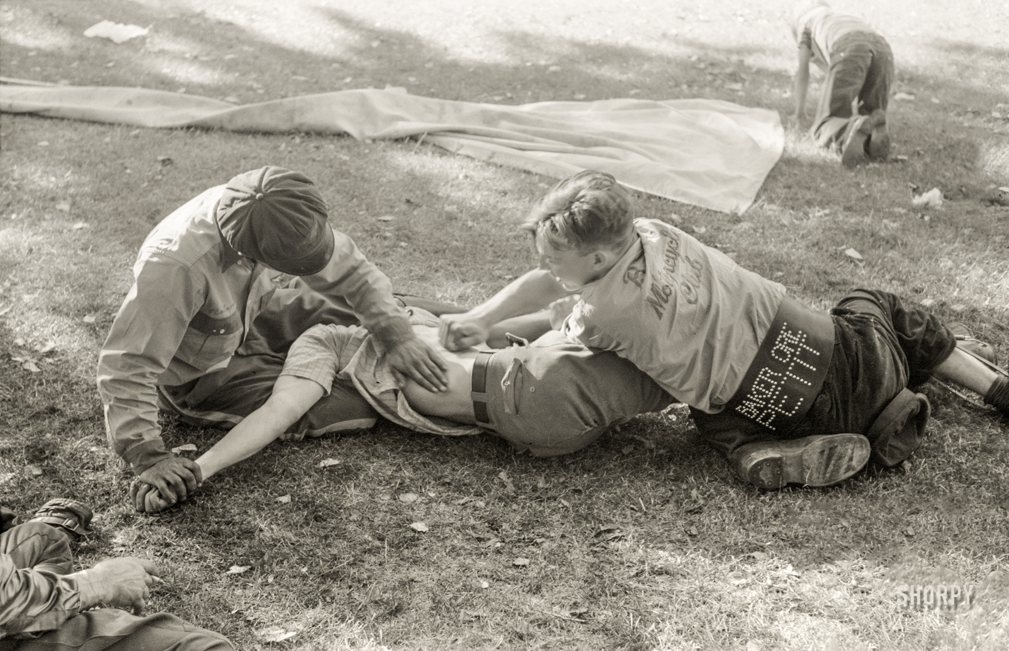 July 1941. "Roughhousing at Fourth of July picnic, Vale, Oregon." Mess with the boys of the Baker Motorcycle Club at your peril. 35mm acetate negative by Russell Lee. View full size.