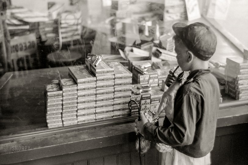 July 1941. "Store with cap guns and fireworks for sale, Fourth of July, Vale, Oregon." 35mm acetate negative by Russell Lee for the Farm Security Administration. View full size.

