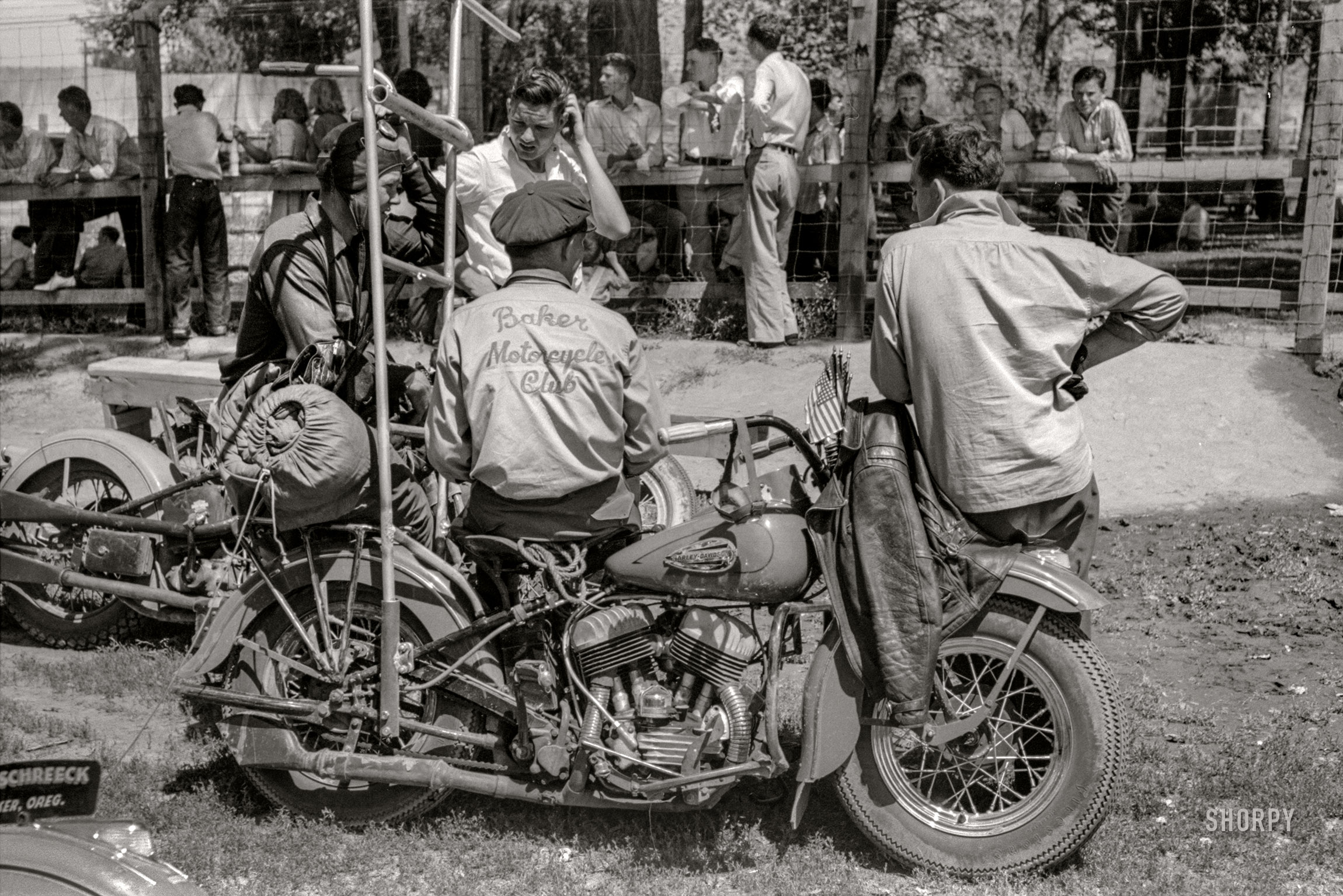 July 1941. "Motorcycle racers, Fourth of July, Vale, Oregon." Members of the Baker Motorcycle Club, last seen here. 35mm acetate negative by Russell Lee. View full size.