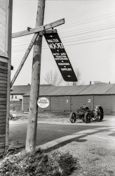 October 1940. "Metal sign blowing in the wind. Doyon, North Dakota." 35mm acetate negative by John Vachon for the Farm Security Administration. View full size.