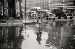 November 1940. "Main street intersection in Norwich, Connecticut, on a rainy day." 35mm nitrate negative by Jack Delano. View full size.