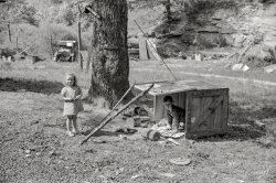 September 1938. "WPA (Works Progress Administration) worker's children with toys in their play yard. South Charleston, West Virginia." Last seen here. Photo by Marion Post Wolcott for the Resettlement Administration. View full size.