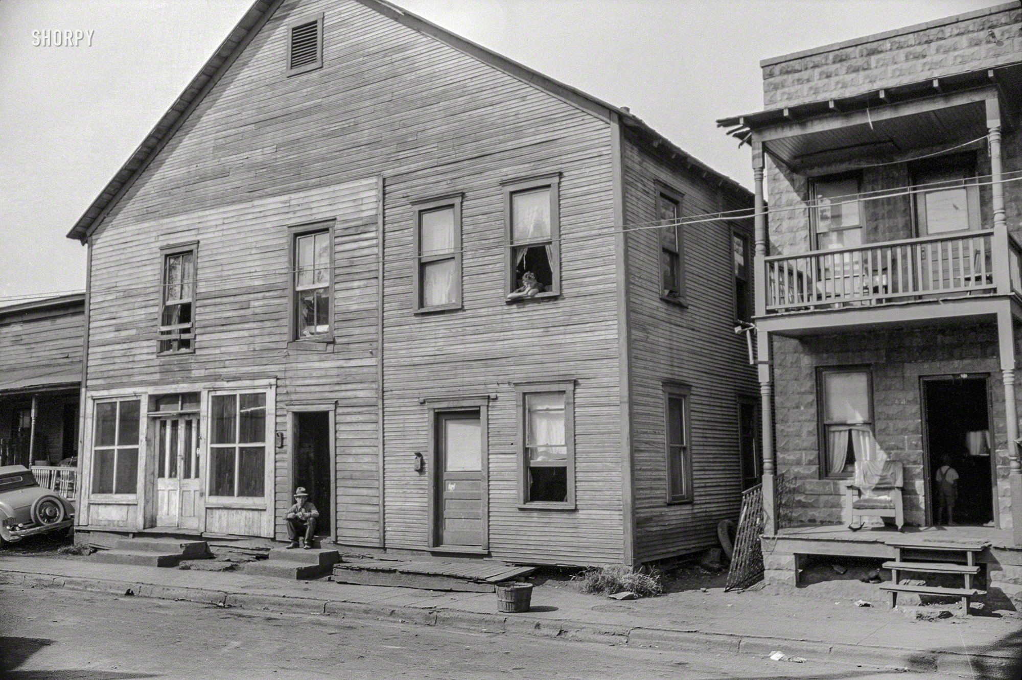 September 1938. "House, Negro and white section, Charleston, West Virginia." 35mm nitrate negative by Marion Post Wolcott. View full size.