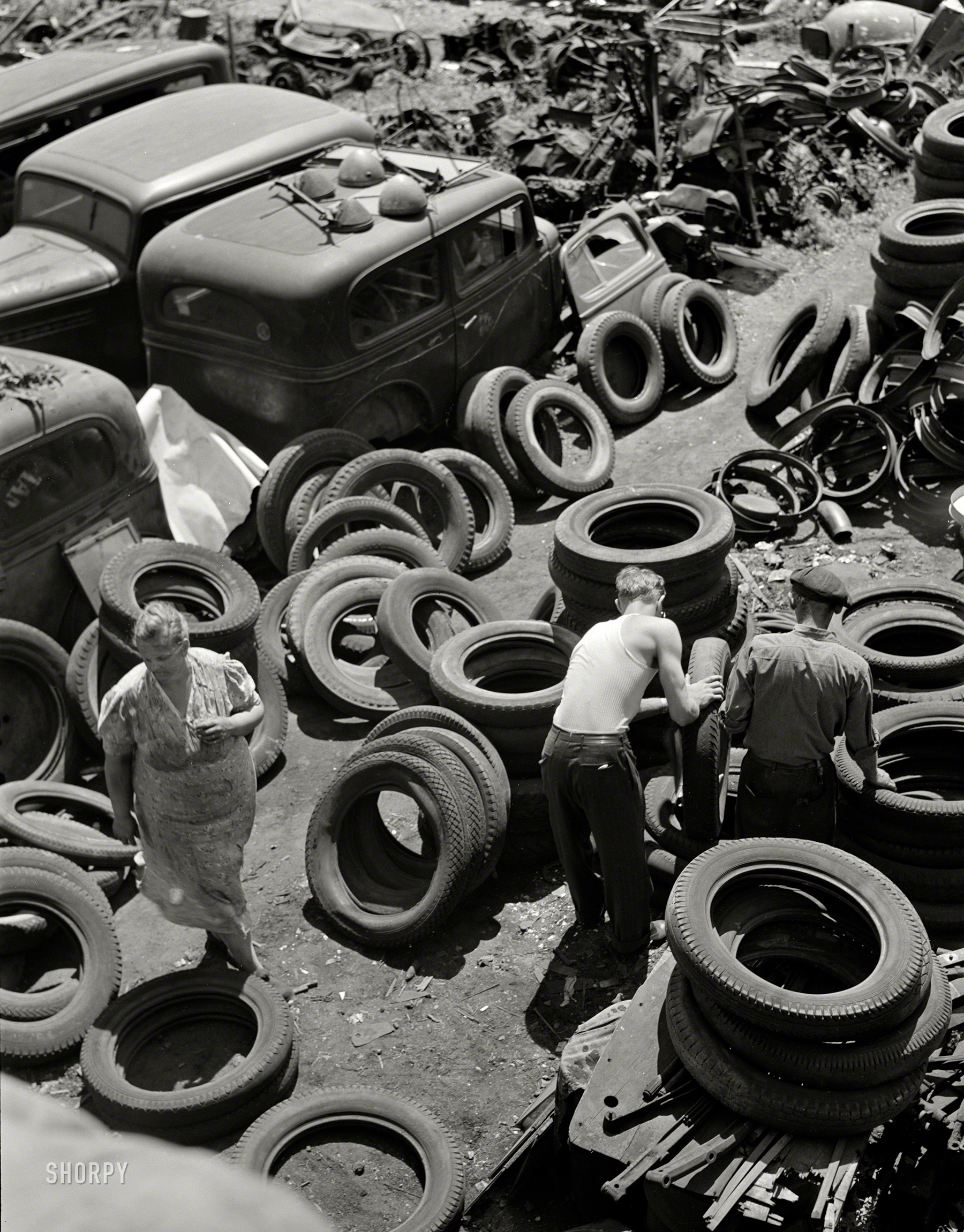 July 1942. "Salvage. Chicago automobile graveyard. Idle scrap: It belongs in the scrap. Covering well over an acre, this automobile graveyard in Chicago holds tons of vital scrap metal and rubber for which Uncle Sam has urgent need in the manufacture of armaments and other war materials." 4x5 inch nitrate negative by Ann Rosener for the Office of War Information. View full size.