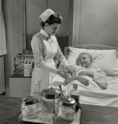 November 1942. Babies' Hospital, New York. "Student nurses, like Susan Petty of Lebanon, Pennsylvania, are rendering their country a great service by making it possible for experienced nurses to join the Army or Navy Nurse Corps. Relieved of such civilian duties as administering injections to patients like this smiling youngster, graduate nurses are tending America's fighting men in distant parts of the world." Photo by Fritz Henle, Office of War Information. View full size.