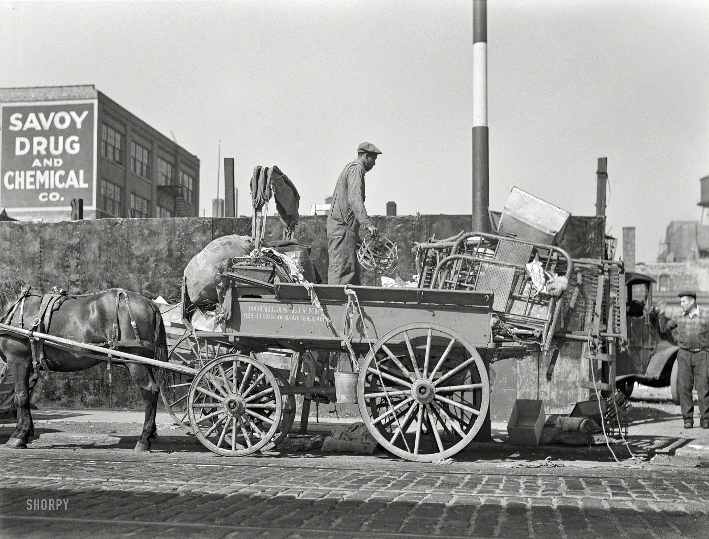 October 1942. Chicago, Illinois. "Salvage. To feed the nation's munitions furnaces, tons of scrap from America's attics and basements are collected every day. Here, a junkman unloads his wagon in a central depot, where the scrap will be segregated and graded for shipment to steel mills." Medium format nitrate negative  by Ann Rosener for the Office of War Information. View full size.