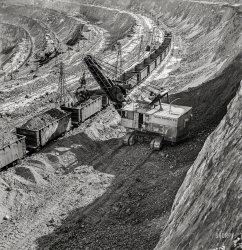 November 1942. "Loading copper ore at the open-pit mining operations of Utah Copper Company at Bingham Canyon." Medium format nitrate negative by Andreas Feininger for the Office of War Information. View full size.